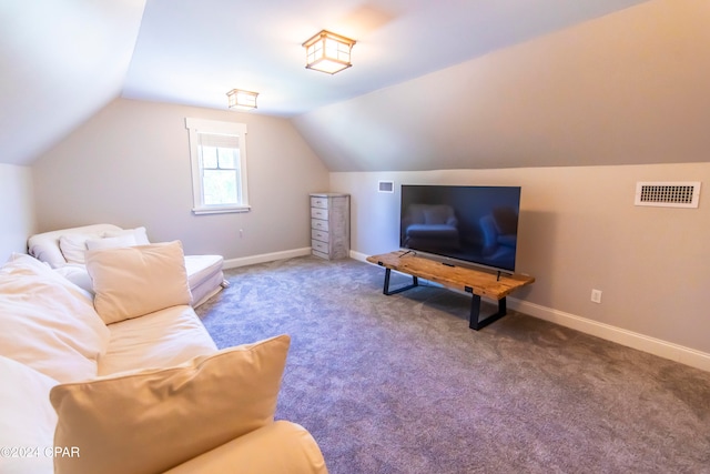 living room featuring vaulted ceiling and carpet flooring