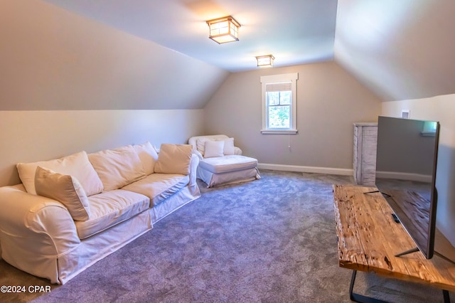 interior space featuring carpet flooring and lofted ceiling