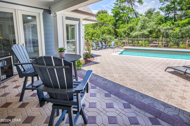 view of pool featuring a patio