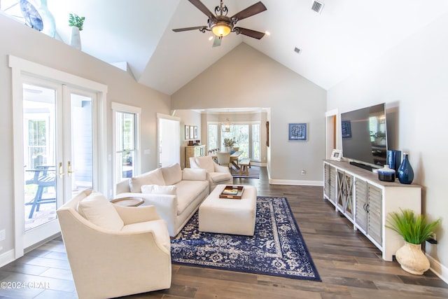 living room with dark hardwood / wood-style flooring, high vaulted ceiling, french doors, and ceiling fan