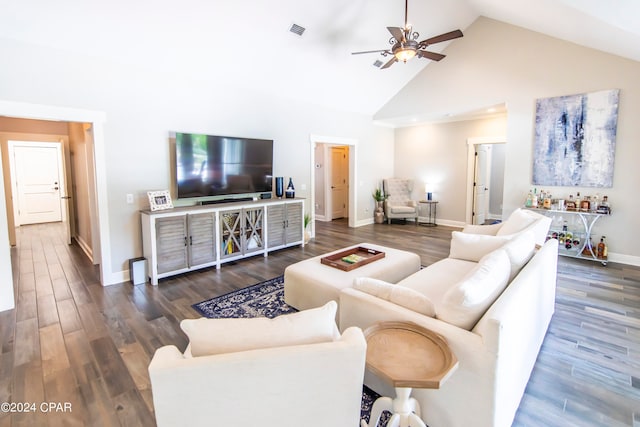 living room featuring ceiling fan, high vaulted ceiling, and dark wood-type flooring