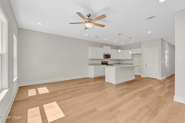 living room featuring hardwood / wood-style floors and crown molding