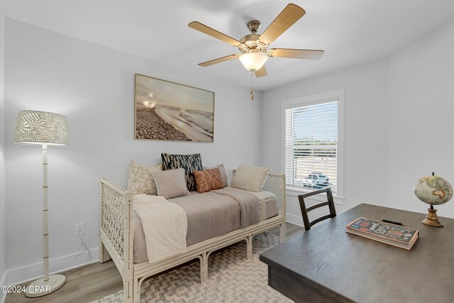 bedroom with ceiling fan and light hardwood / wood-style floors