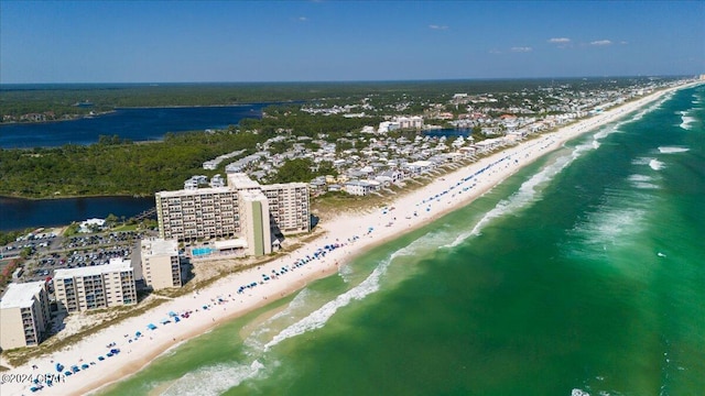 bird's eye view featuring a view of the beach and a water view