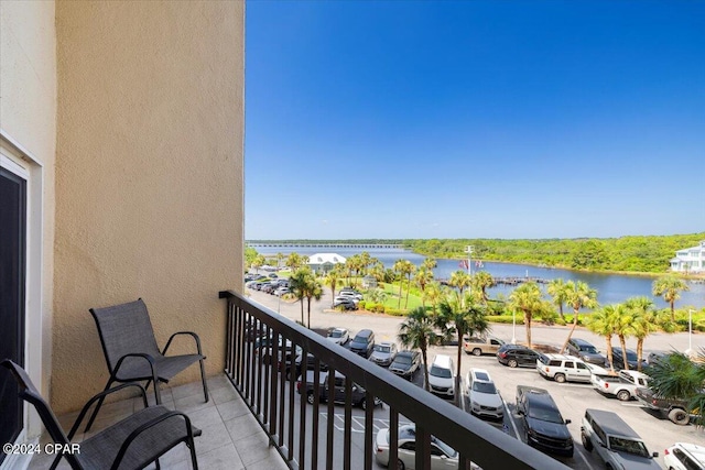 balcony featuring a water view