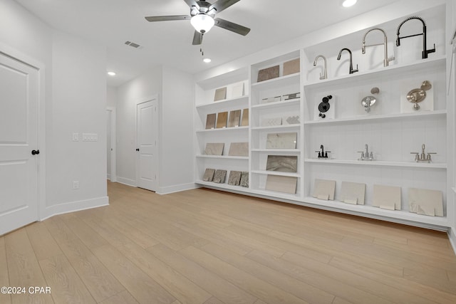 spare room featuring ceiling fan and light hardwood / wood-style floors