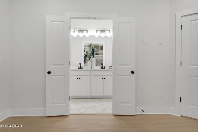 bathroom featuring hardwood / wood-style floors and vanity