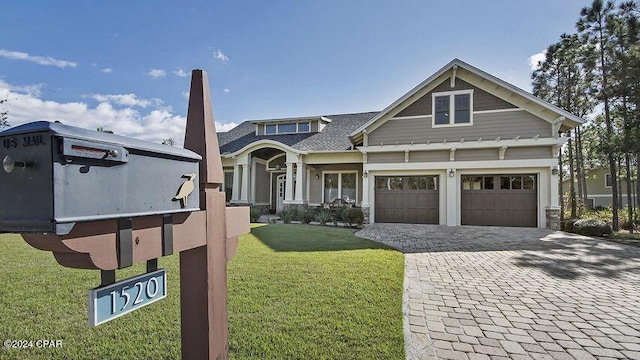 view of front of property with decorative driveway and a front yard