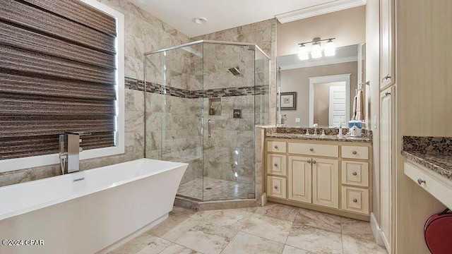 bathroom featuring crown molding, vanity, and independent shower and bath