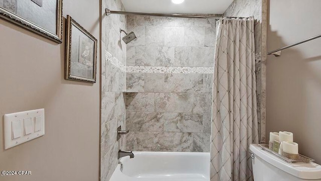 bathroom with toilet and shower / tub combo