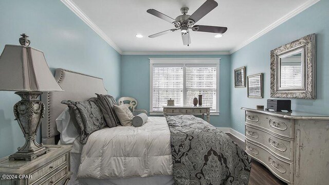 bedroom featuring crown molding, ceiling fan, and dark hardwood / wood-style floors