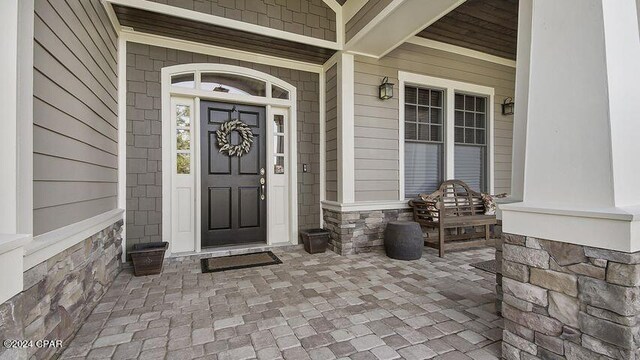 entrance to property featuring a porch