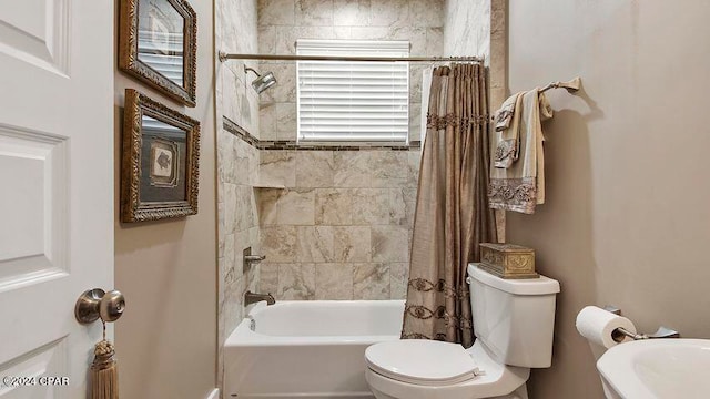 bathroom with toilet, a wealth of natural light, and shower / bathtub combination with curtain