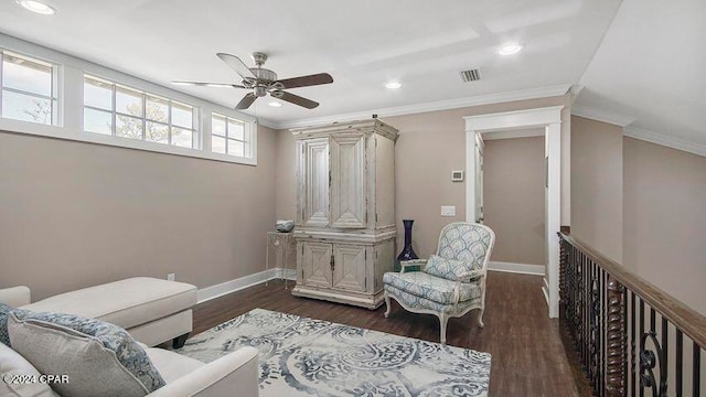 sitting room featuring ceiling fan, dark hardwood / wood-style floors, and crown molding