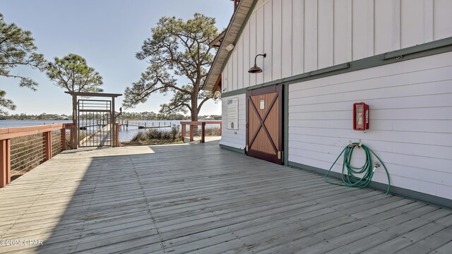 wooden deck with a water view