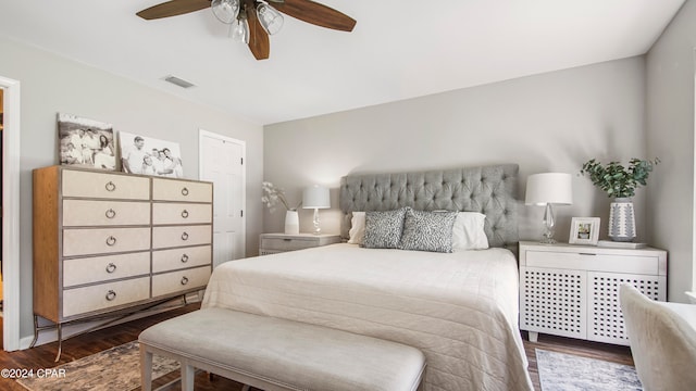 bedroom featuring ceiling fan and dark hardwood / wood-style floors