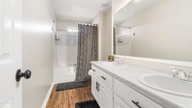 bathroom featuring vanity, hardwood / wood-style floors, and shower / bathtub combination with curtain