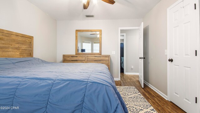 bedroom featuring ceiling fan and dark hardwood / wood-style flooring