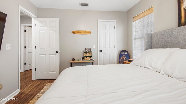 bedroom featuring dark wood-type flooring