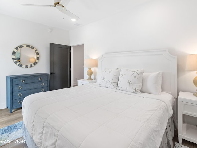 bedroom featuring light wood-type flooring and ceiling fan