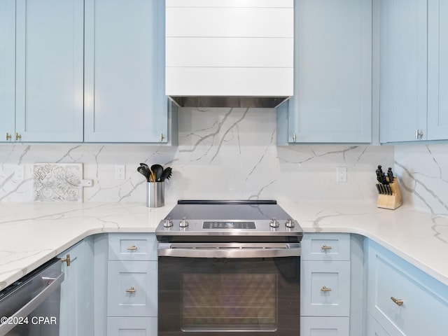 kitchen featuring appliances with stainless steel finishes, tasteful backsplash, light stone counters, and ventilation hood