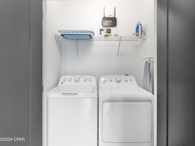 washroom featuring independent washer and dryer