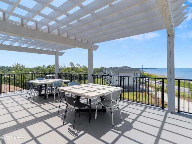 view of patio / terrace featuring a water view and a pergola