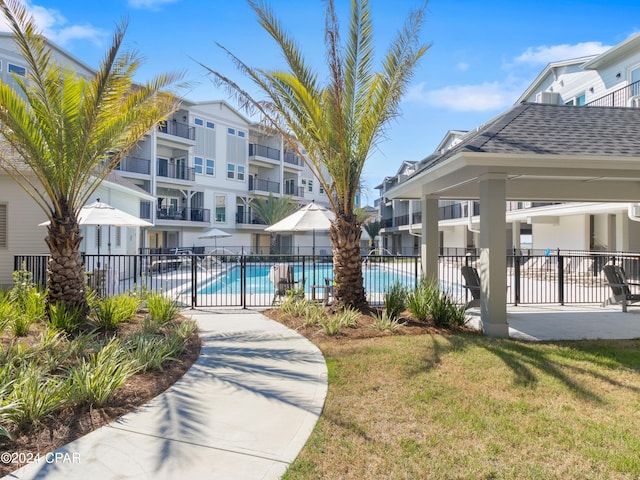 view of pool with a gazebo and a lawn