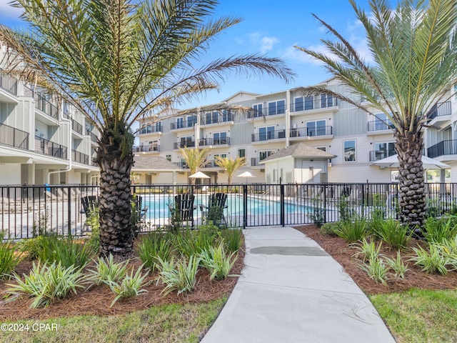 view of property's community featuring a pool