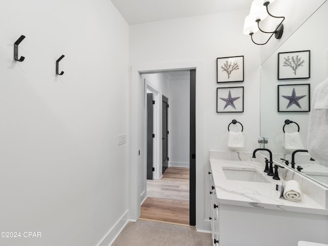 bathroom featuring vanity and hardwood / wood-style floors