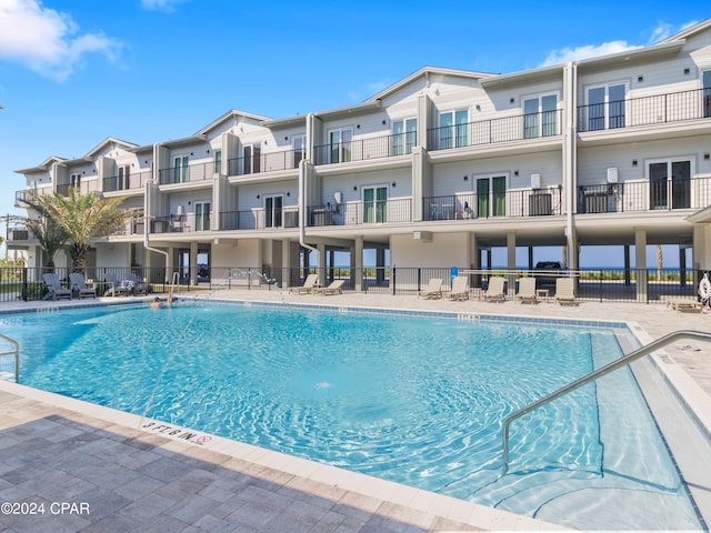 view of swimming pool with a patio area