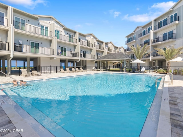 view of swimming pool with a patio area