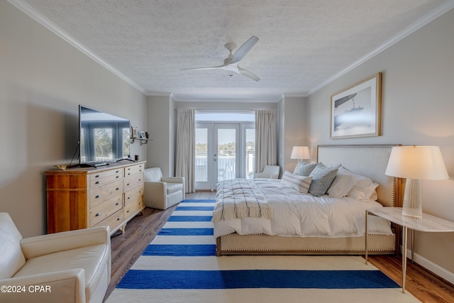 244 E 3rd Pl, Panama City, FL 32401 - bedroom featuring multiple windows, ornamental molding, access to exterior, and wood finished floors