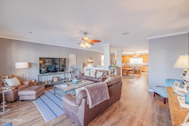 244 E 3rd Pl, Panama City, FL 32401 - living area with ornamental molding, visible vents, ceiling fan, and light wood-style floors