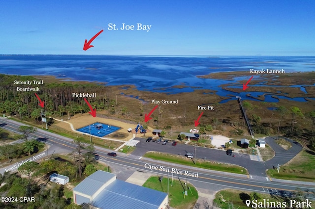 birds eye view of property featuring a water view