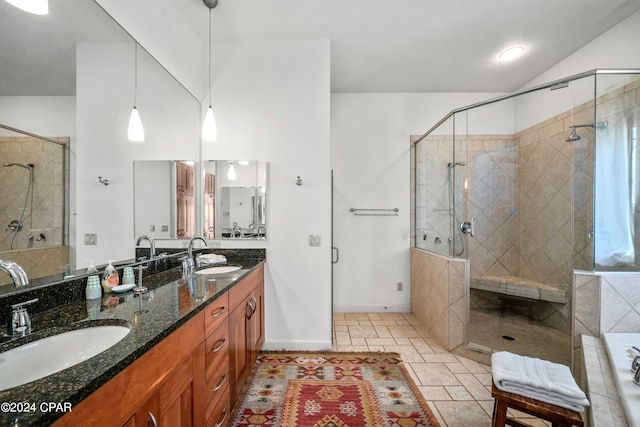 bathroom with plus walk in shower, vanity, and vaulted ceiling