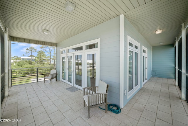 exterior space with wooden ceiling