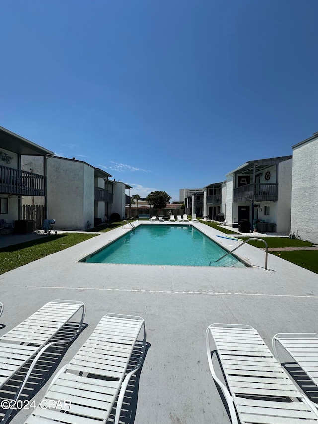 view of swimming pool with a patio area