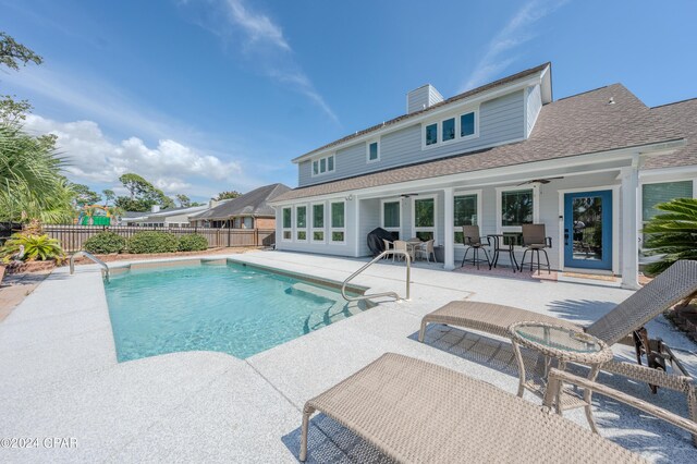 view of pool with a patio and ceiling fan