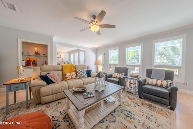 tiled living room featuring built in features, crown molding, and ceiling fan