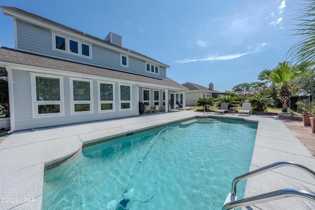 view of pool featuring a patio area