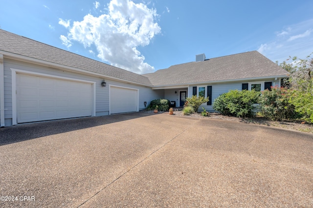 ranch-style home with a garage