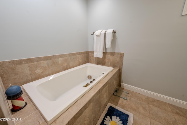 bathroom featuring tile patterned floors and tiled tub