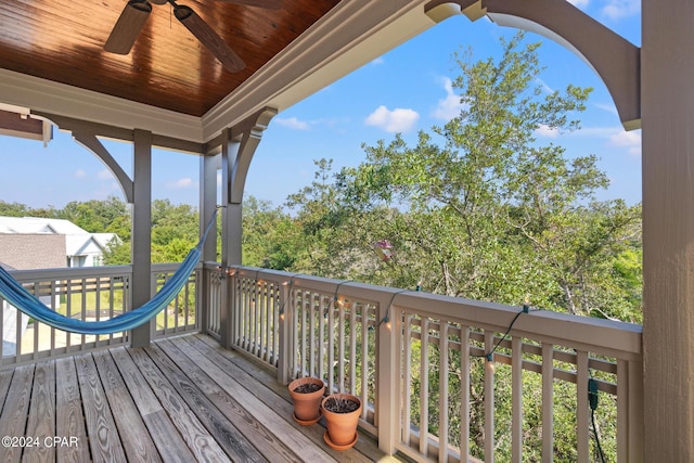 wooden deck featuring ceiling fan