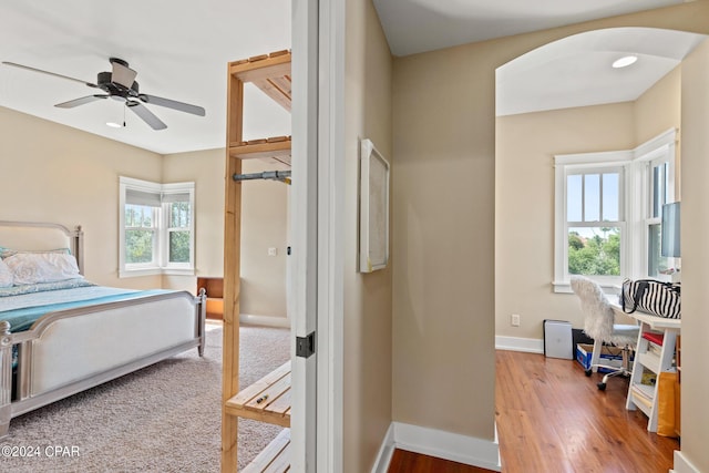 bedroom featuring ceiling fan and wood-type flooring