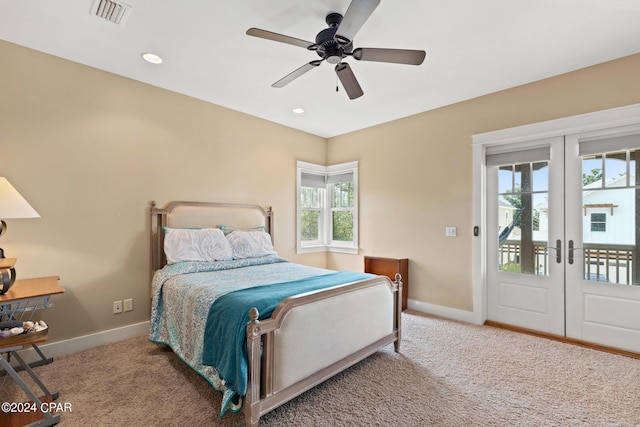 bedroom with french doors, light carpet, access to exterior, and ceiling fan