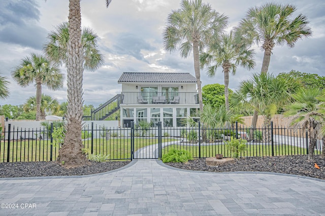 view of front of house featuring a balcony