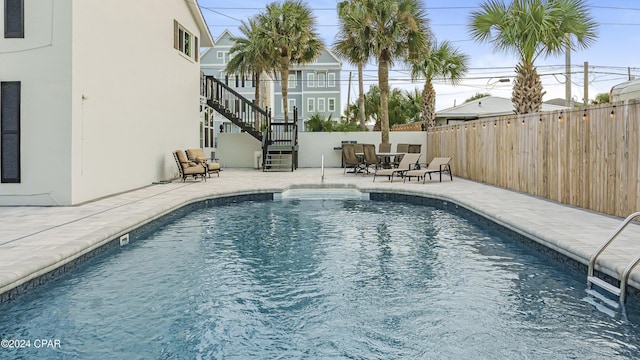 view of swimming pool featuring a patio