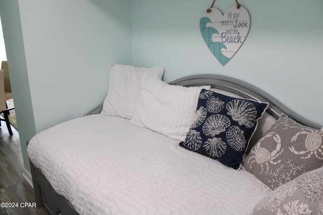 bedroom featuring wood finished floors