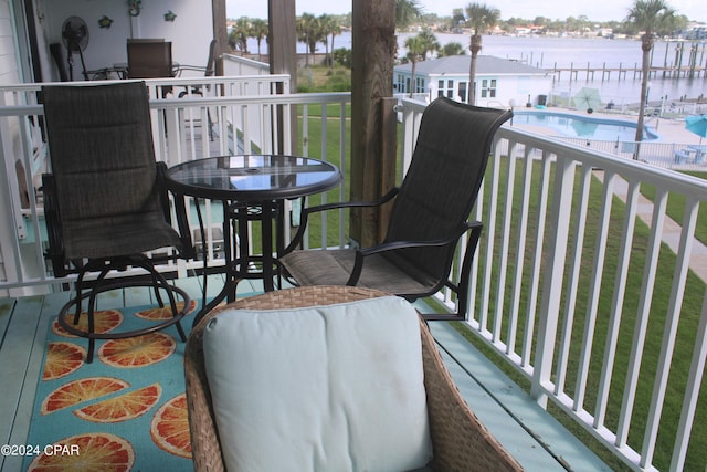 balcony featuring a water view